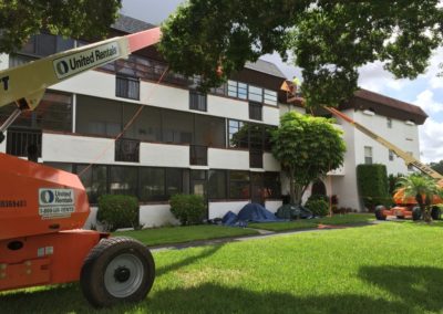 Condominium Roof Replaced Using Lifts in Palm Bay, Florida 32905