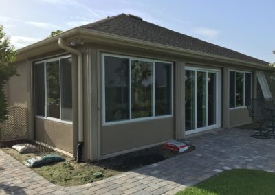 Enclose porch with windows and doors.