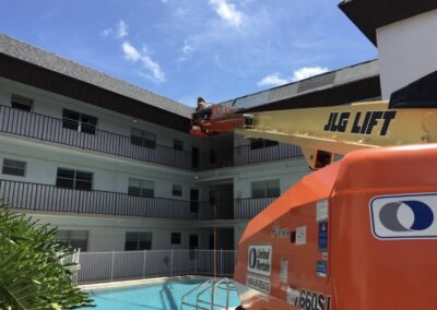 Installing shingles over club house pool area