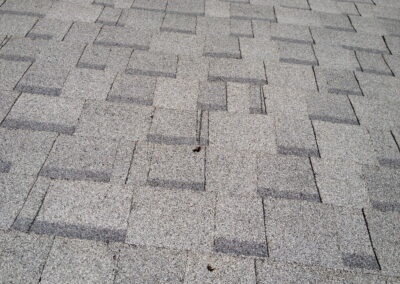 High Roof Nails Pushing Through Shingle Above It